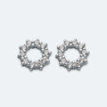 Silver cut out cubic zirconia circle studs.